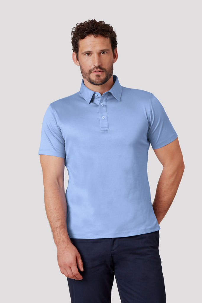 Front view of model wearing men's blue polo shirt made from Egyptian cotton