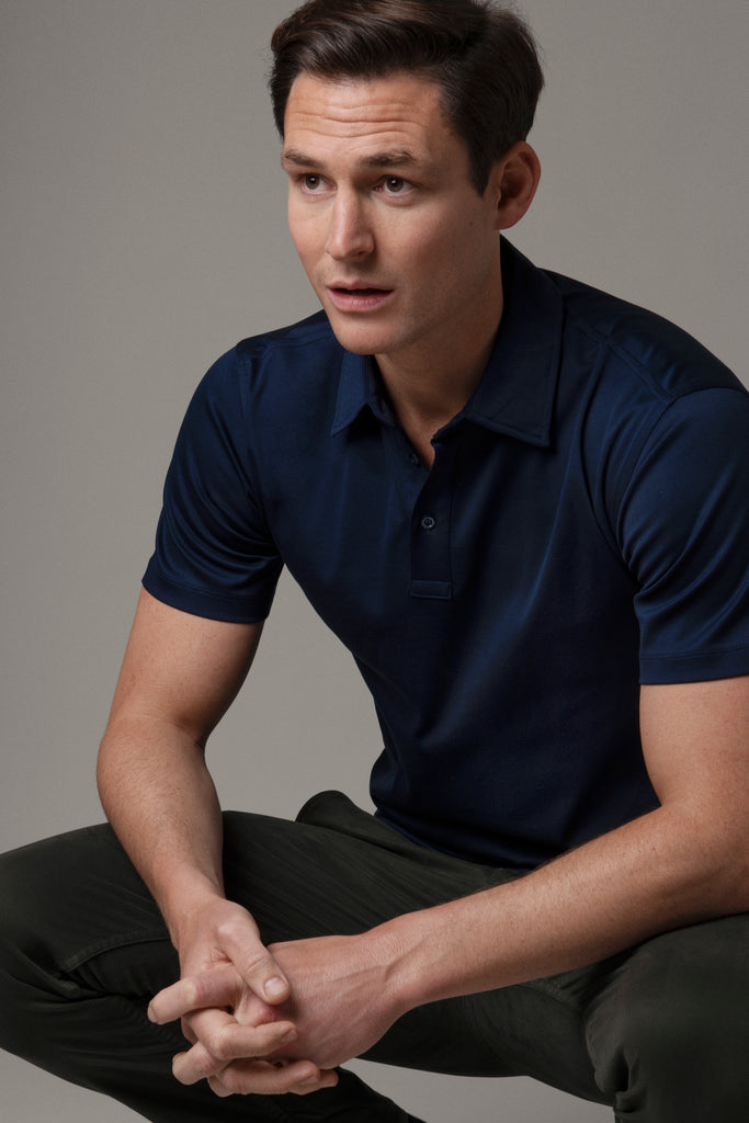 Front view of model wearing men's Inkwell Navy polo shirt made from Egyptian cotton