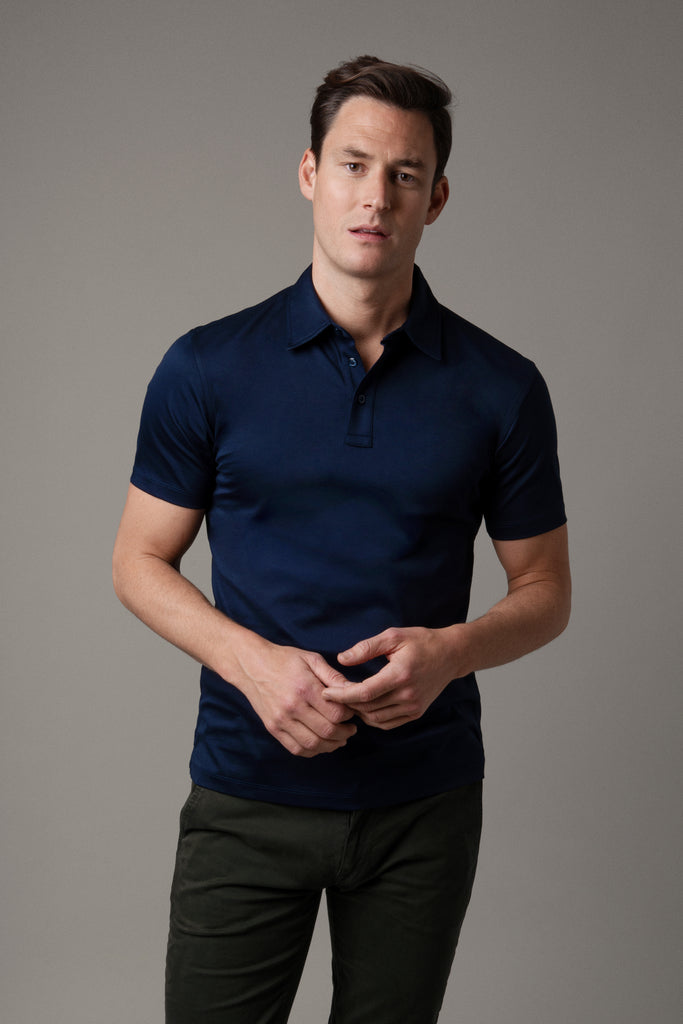 Front view of model wearing men's Inkwell Navy polo shirt made from Egyptian cotton