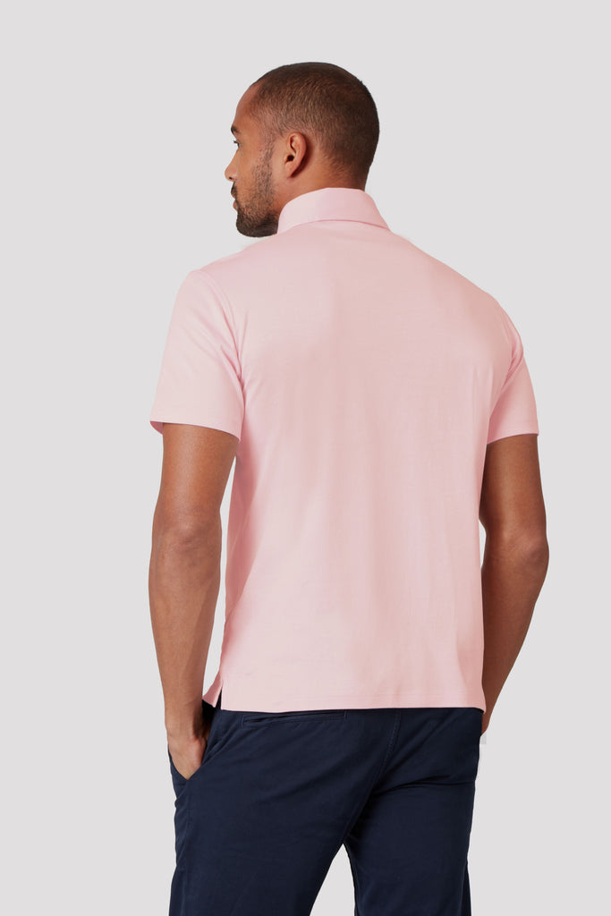 Rear view of model wearing men's Light Lilac polo shirt made from Egyptian cotton