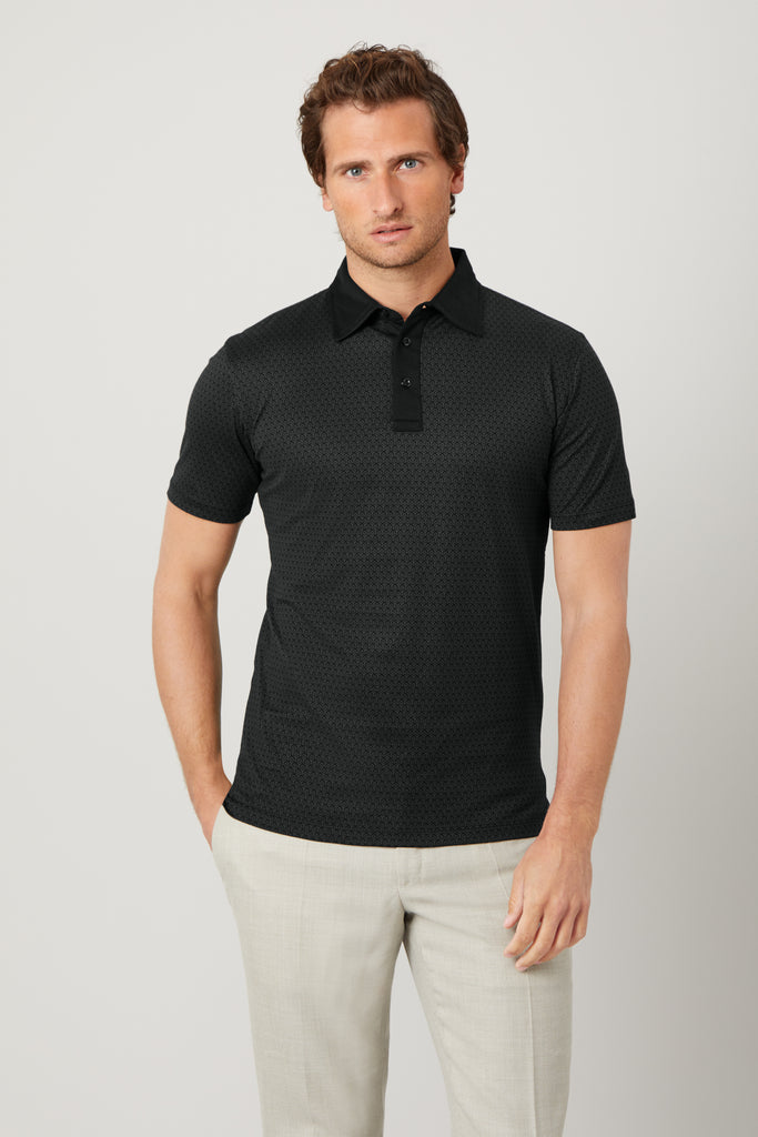 Front view of model wearing men's Limited Edition Pirate Black polo shirt